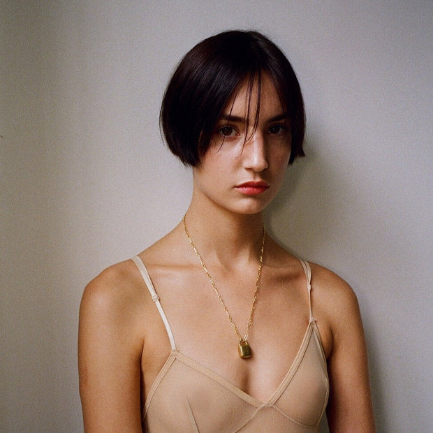Model wears Laura Lombardi Caramella Pendant