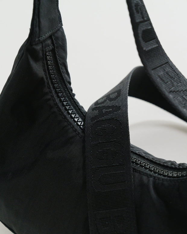 close up of Baggu Mini Recycled Nylon Crescent Bag - Black zip and handle